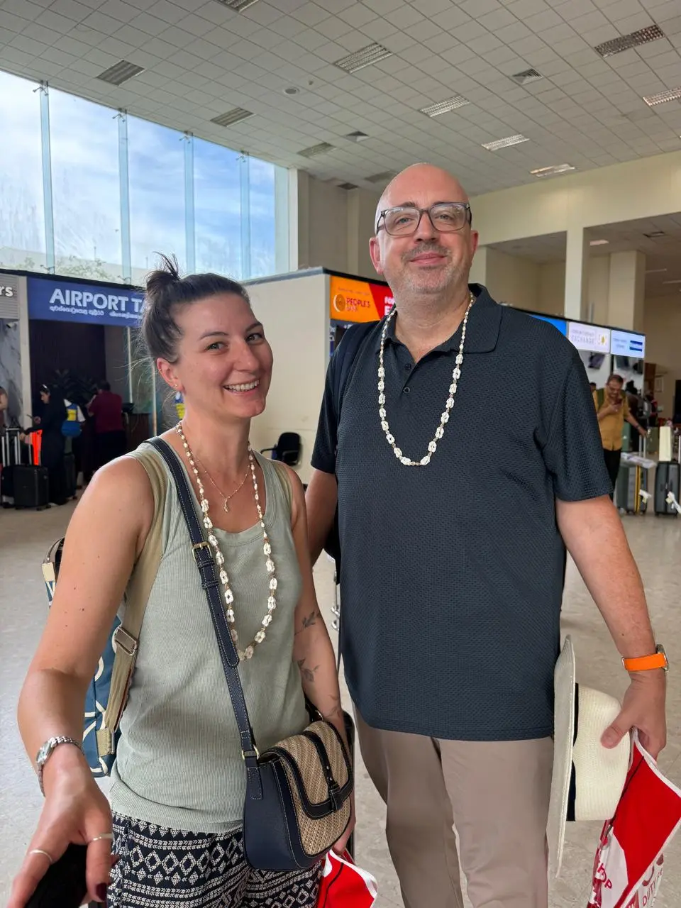 Warm airport welcome at Colombo Bandaranaike International Airport with seashell garlands